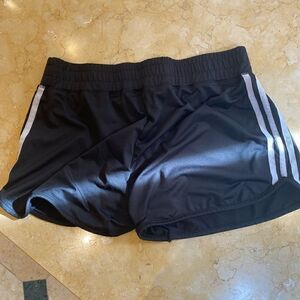 Black athletic shorts with white detail